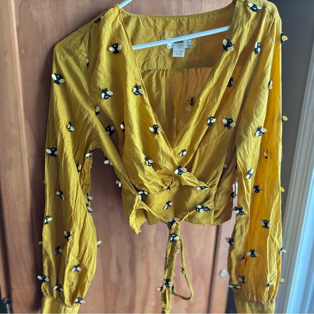 Anthropologie Long sleeve embroidered wrap blouse